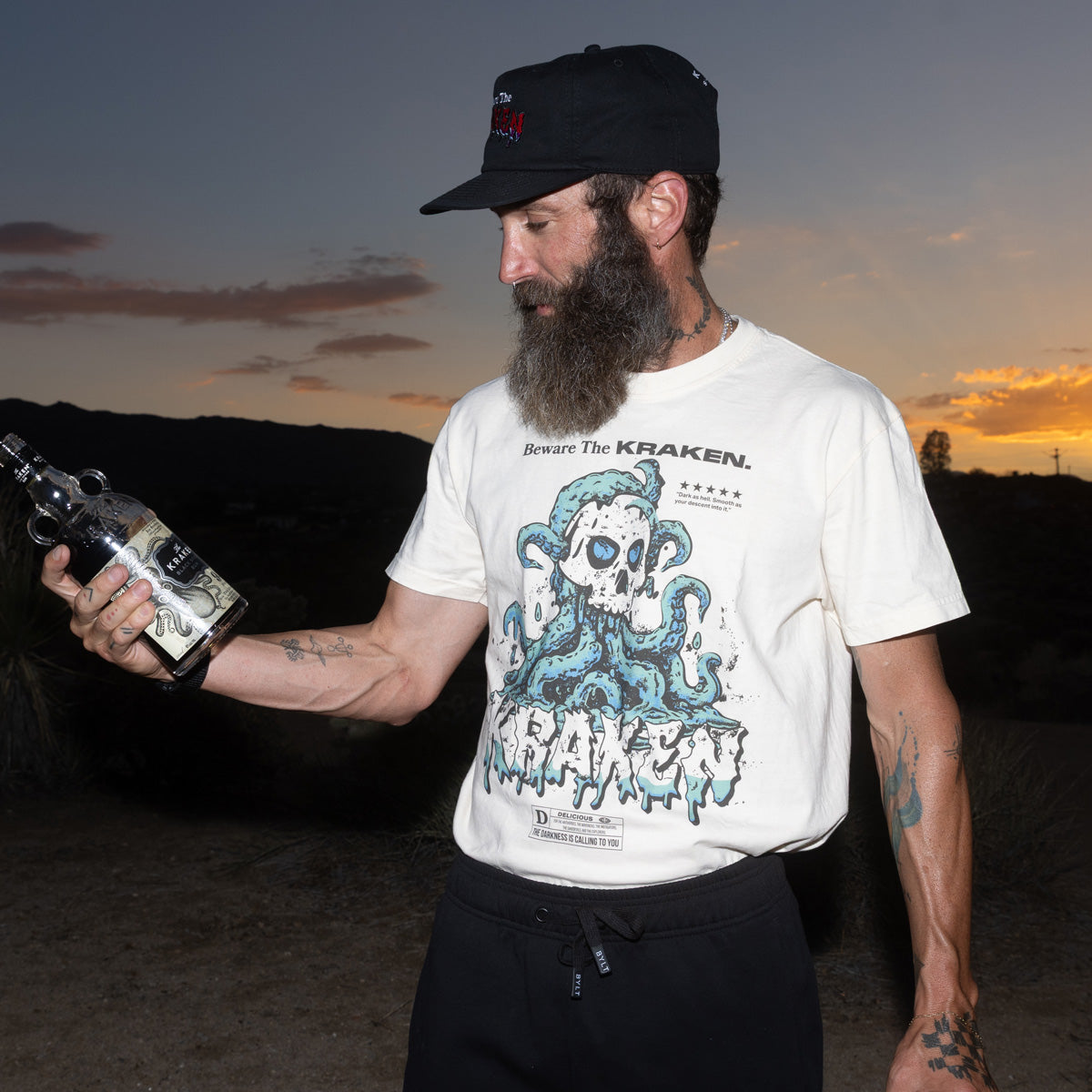 Front view of the Beware The Kraken Tee in ivory on a male model in the desert
