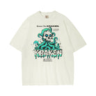 Front view of the Beware The Kraken Tee in ivory with a graphic of a white skull with teal eyes surrounded by green and teal kraken tentacles, with dripping white and teal text that reads 'KRAKEN'