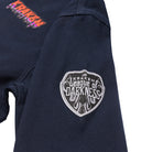 A close up view image of the Beware The Kraken Coveralls with a League of Darkness patch on the left sleeve