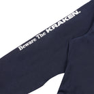 A close up view image of the Beware The Kraken Coveralls with the words "Beware The KRAKEN." down the right sleeve.
