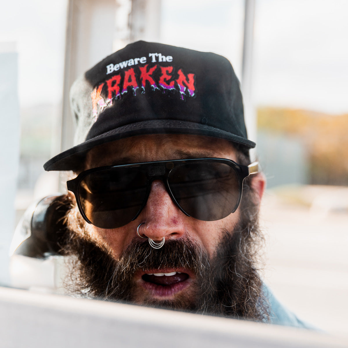 Lifestyle image of male model wearing the Beware The Kraken hat