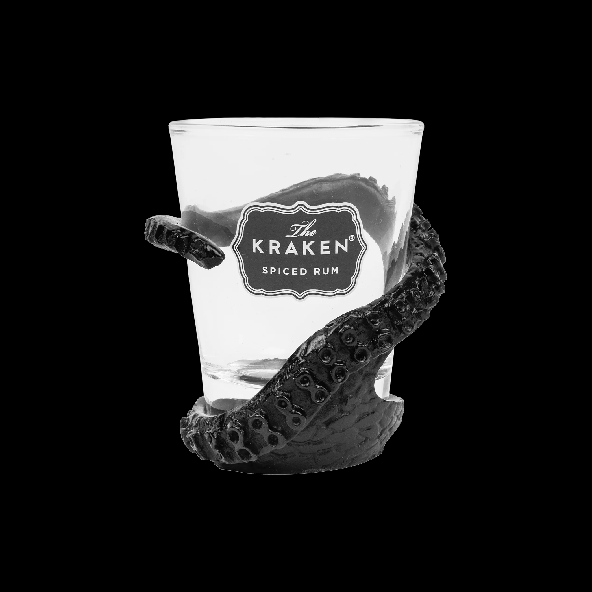 Clear shot glass with 'The Kraken Spiced Rum' label and black tentacle design