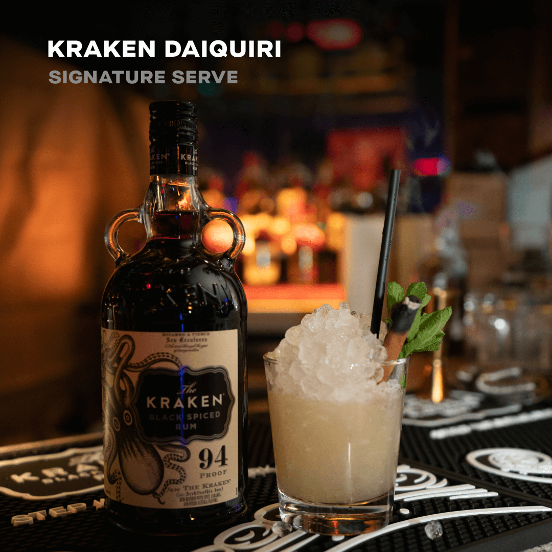 A Kraken Black Spiced Rum bottle and Kraken Daiquiri signature cocktail blended from Black Spiced Rum.