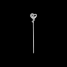 Silver heart-shaped cocktail pick on a black background