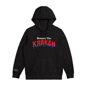 Front image of Beware The Kraken Hoodie in black with red and purple drip design of "KRAKEN" in the middle and The Kraken spiced Rum logo in white on the right cuff.