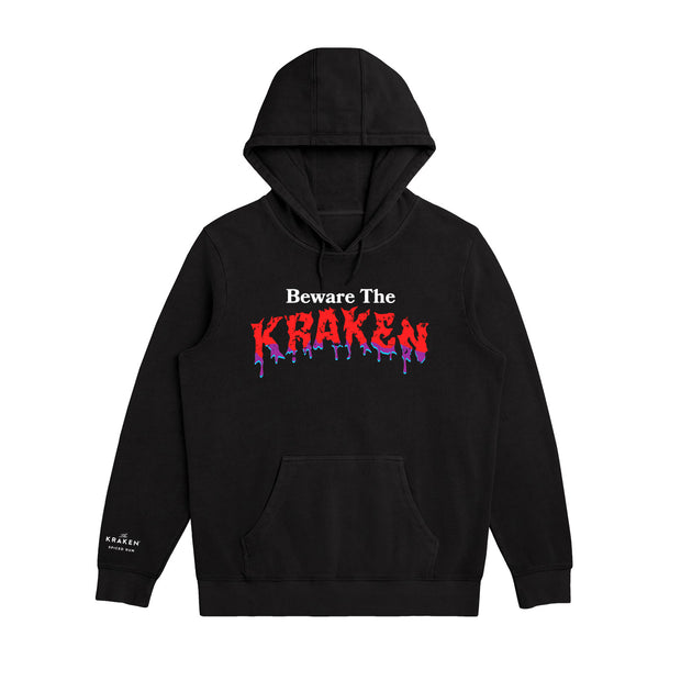 Front image of Beware The Kraken Hoodie in black with red and purple drip design of "KRAKEN" in the middle and The Kraken spiced Rum logo in white on the right cuff.