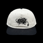 White cap with black Kraken design on a black background