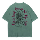 Green t-shirt with a large, intricate black illustration of The Kraken with multiple tentacles. Curved text above and below The Kraken reads "Legendary Beast of the Sea" in a gothic-style font.
Below the kraken, smaller text states "The KRAKEN® SPICED RUM," indicating the brand.