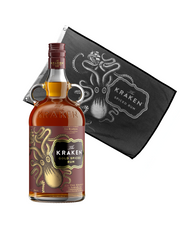 A 750ml size bottle of Kraken Gold Spiced Rum, featuring a sweet and rich flavor profile of cinnamon, vanilla, and nutmeg next to an unfurlled Kraken flag.