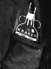 A detailed view of the Kraken-uggies's pocket and black plus fabric, showcasing the Kraken bottle illustration detail.