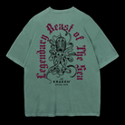 Green t-shirt with a large, intricate black illustration of The Kraken with multiple tentacles. Curved text above and below The Kraken reads "Legendary Beast of the Sea" in a gothic-style font.
Below the kraken, smaller text states "The KRAKEN® SPICED RUM," indicating the brand.