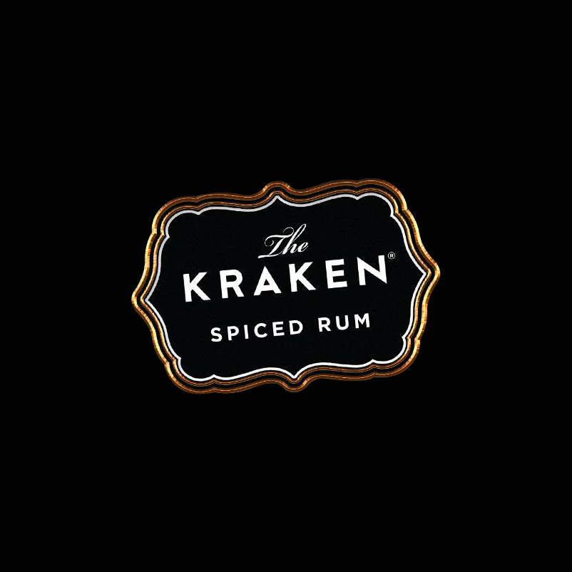 Kraken logo pin that says: "The Kraken Spiced Rum," with a black background, white text, and a gold border.