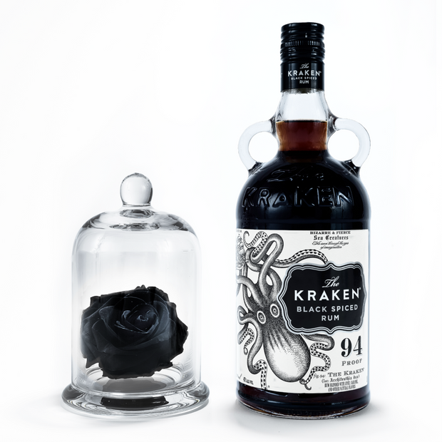 A bottle of Kraken Black Spiced Rum with a Dome featureing a large size single preserved black rose.