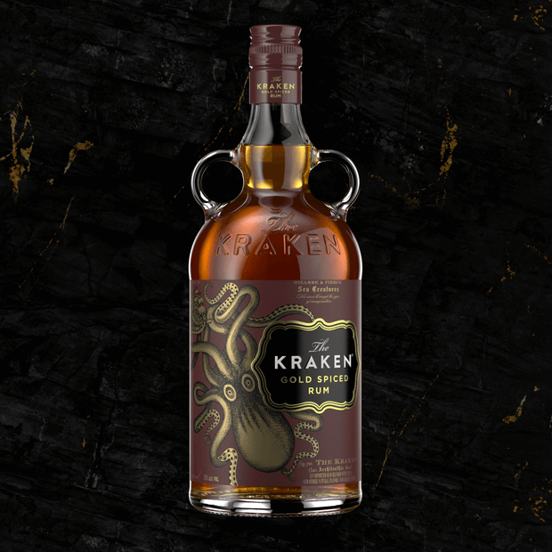 A bottle of the 750ml Kraken Gold Spiced Rum, featuring a sweet and rich flavor profile of cinnamon, vanilla, and nutmeg.