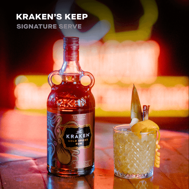 A Kraken Gold Spiced Rum bottle and Kraken's Keep signature cocktail blended from Gold Spiced Rum.